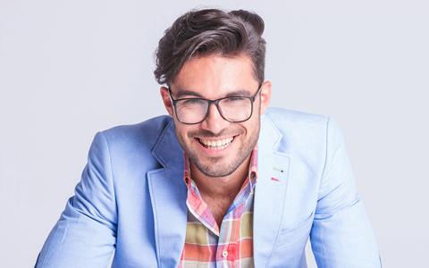 handsome man with trendy hair and light blue suit jacket