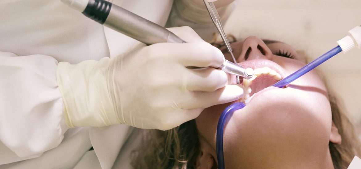 dentist working on a woman's teeth