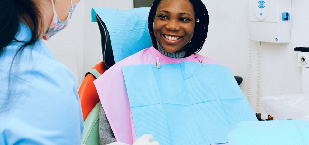 woman smiling in a dentist chair