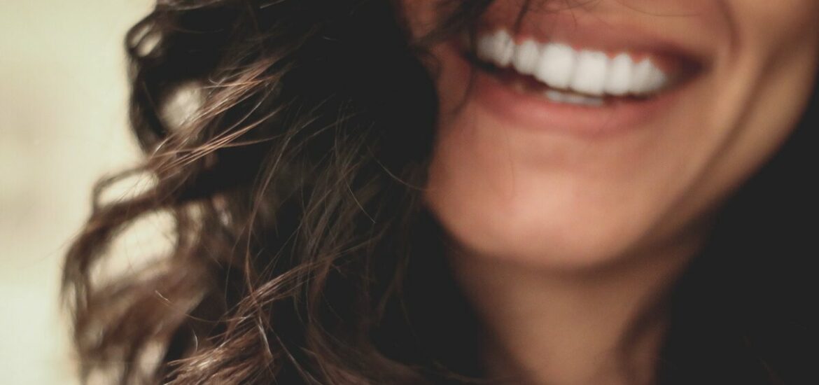 smiling woman with brown hair